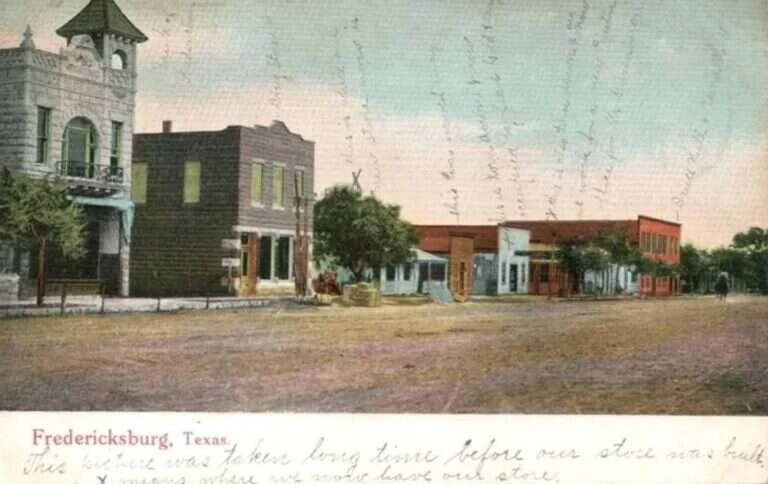 Hand-tinted 1910 postcard of Main Street in Fredericksburg, Texas
